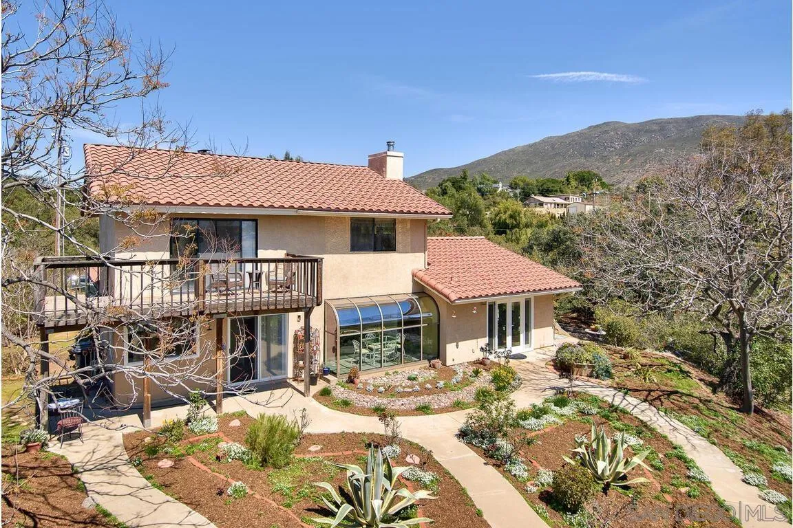 2877 Polk Road Alpine, CA 91901 - Photo 2 of 40 a front view of a house with a yard and balcony