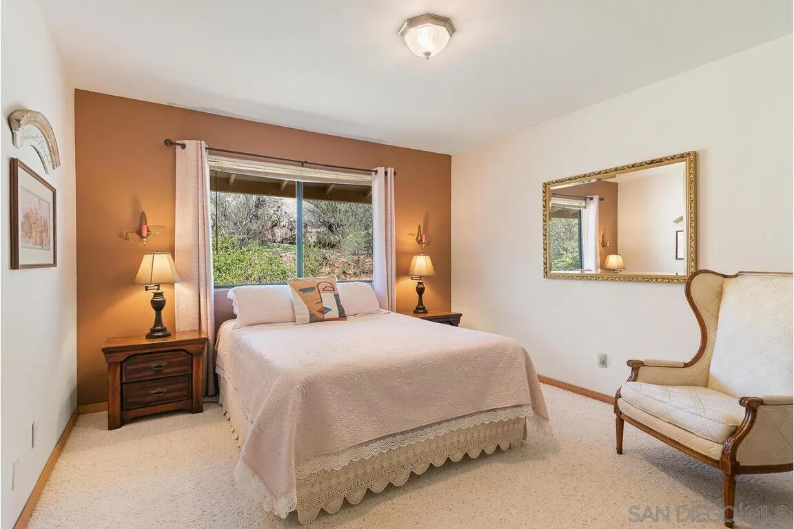 2877 Polk Road Alpine, CA 91901 - Photo 21 of 40 a bedroom with a bed chair and window