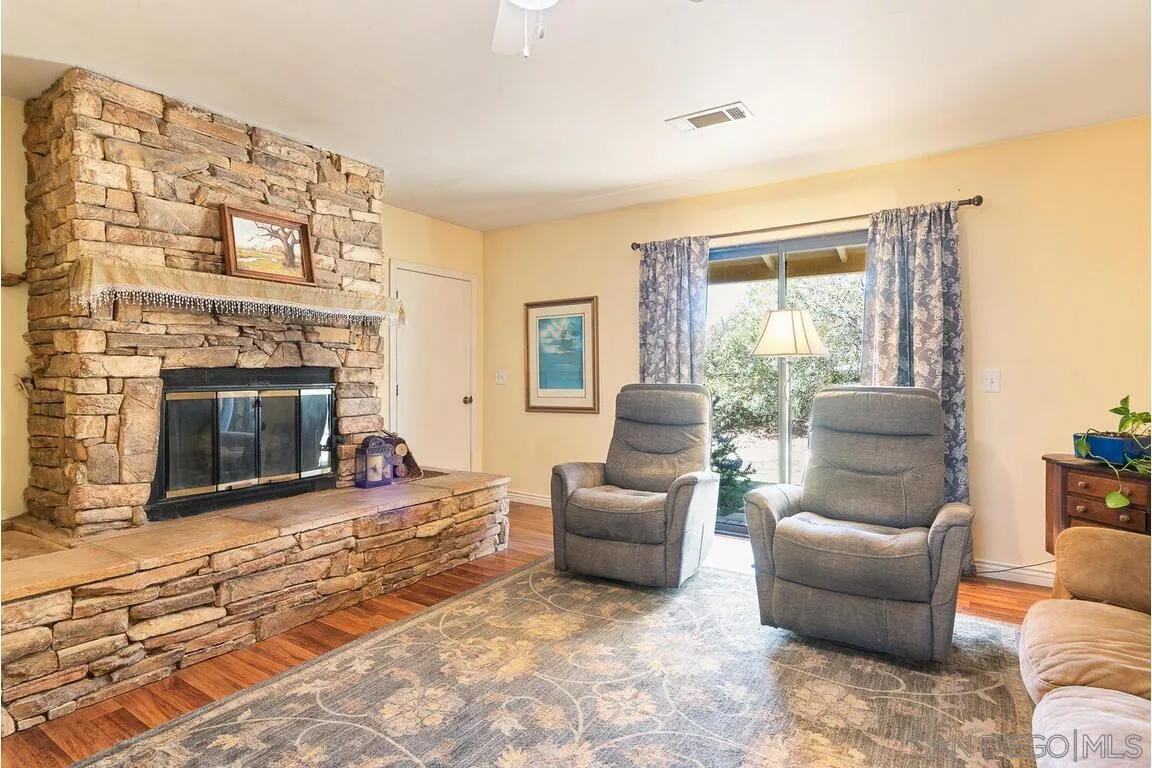 2877 Polk Road Alpine, CA 91901 - Photo 23 of 40 a living room with furniture and a fireplace