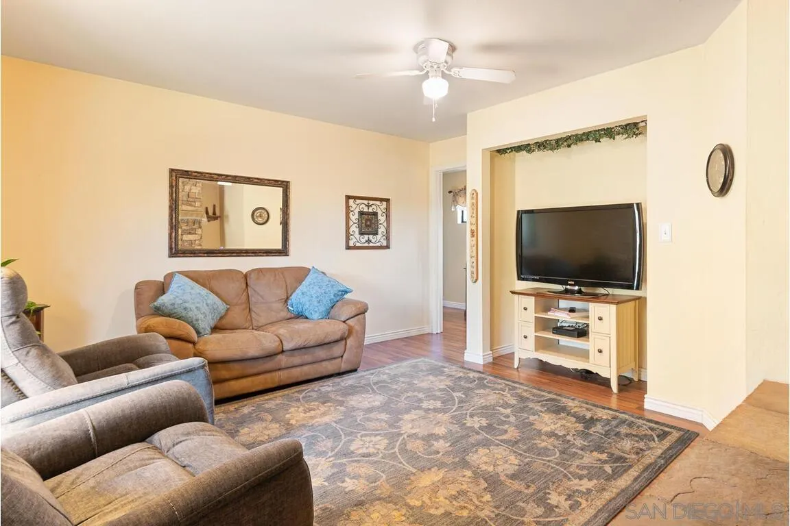 2877 Polk Road Alpine, CA 91901 - Photo 24 of 40 a living room with furniture and a flat screen tv