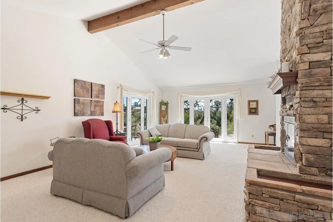 2877 Polk Road Alpine, CA 91901 - Photo 8 of 40 a living room with furniture and a chandelier