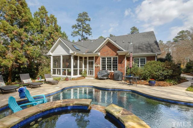 a house with swimming pool in front of it