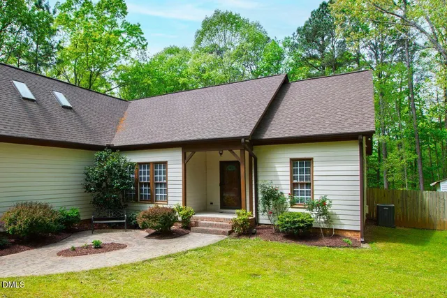 a backyard of a house with seating space