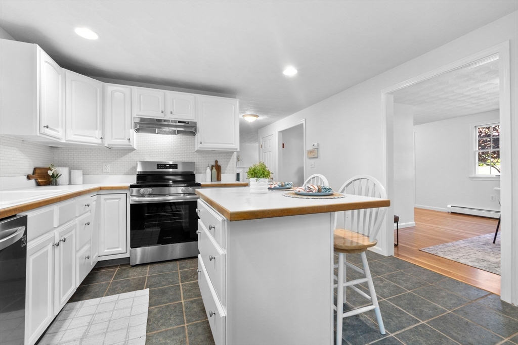 40 Cornell Road Beverly, MA 01915 - Photo 11 of 31 a kitchen with stainless steel appliances a sink counter space and cabinets