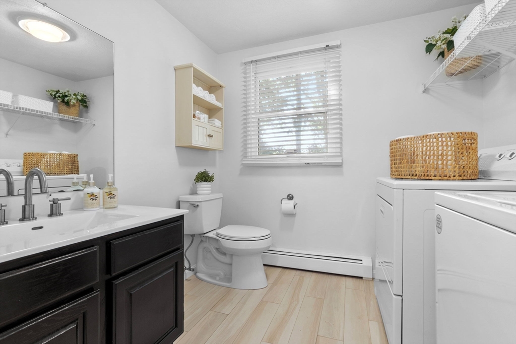 40 Cornell Road Beverly, MA 01915 - Photo 13 of 31 a bathroom with a toilet a sink and mirror