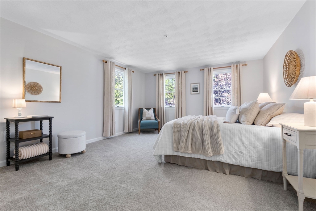 40 Cornell Road Beverly, MA 01915 - Photo 17 of 31 a spacious bedroom with a bed and a lamp