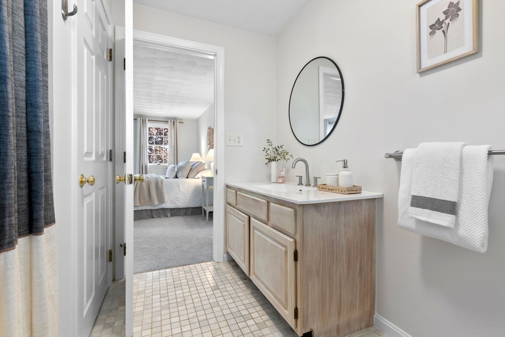 40 Cornell Road Beverly, MA 01915 - Photo 20 of 31 a en suite bathroom with a double vanity sink and a mirror
