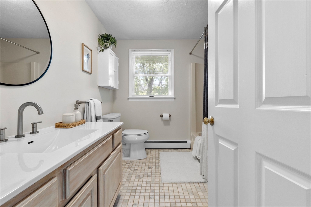40 Cornell Road Beverly, MA 01915 - Photo 21 of 31 a bathroom with a sink a toilet and a mirror