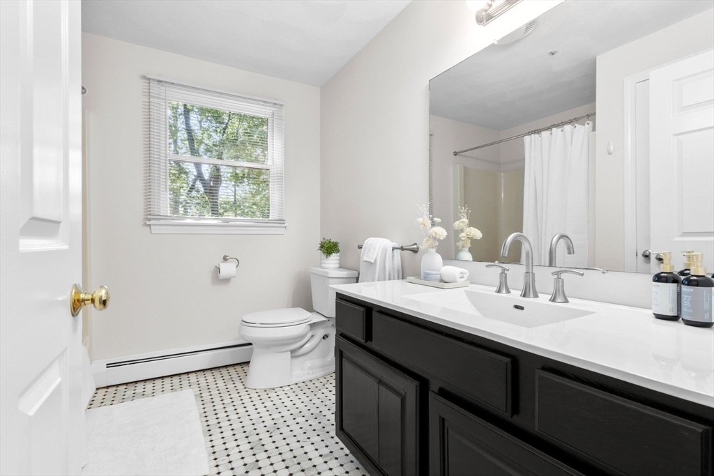 40 Cornell Road Beverly, MA 01915 - Photo 25 of 31 a bathroom with a double vanity sink toilet and a mirror