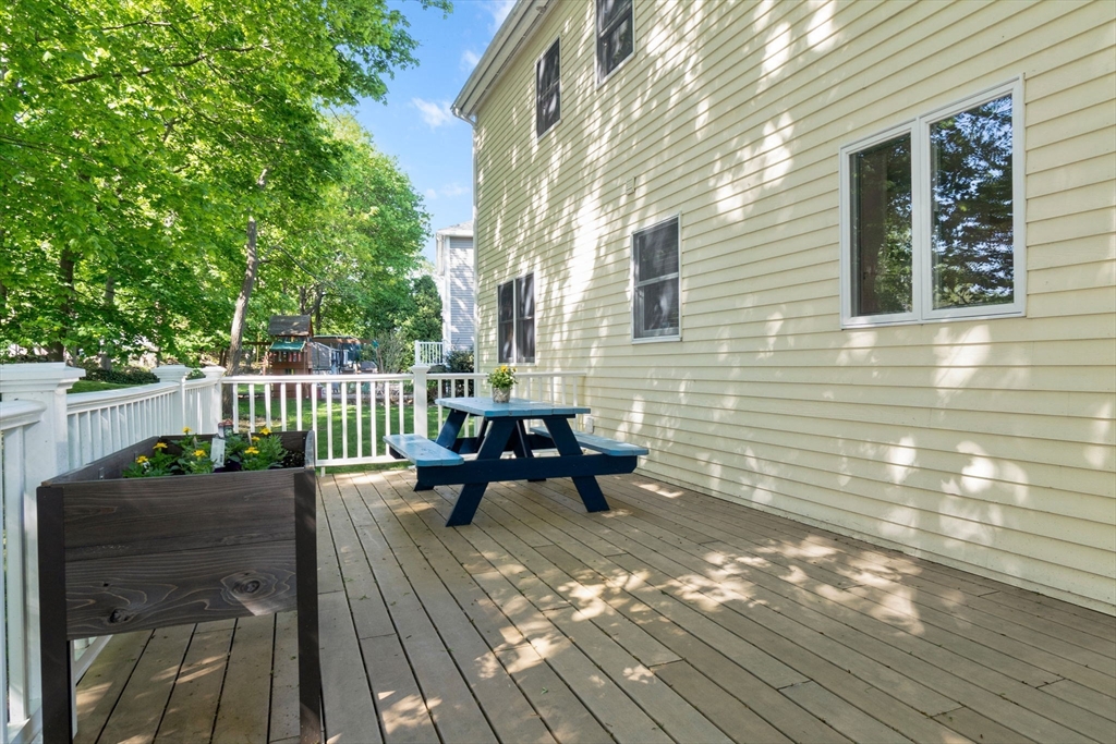 40 Cornell Road Beverly, MA 01915 - Photo 31 of 31 a view of a deck with table and chairs and wooden floor