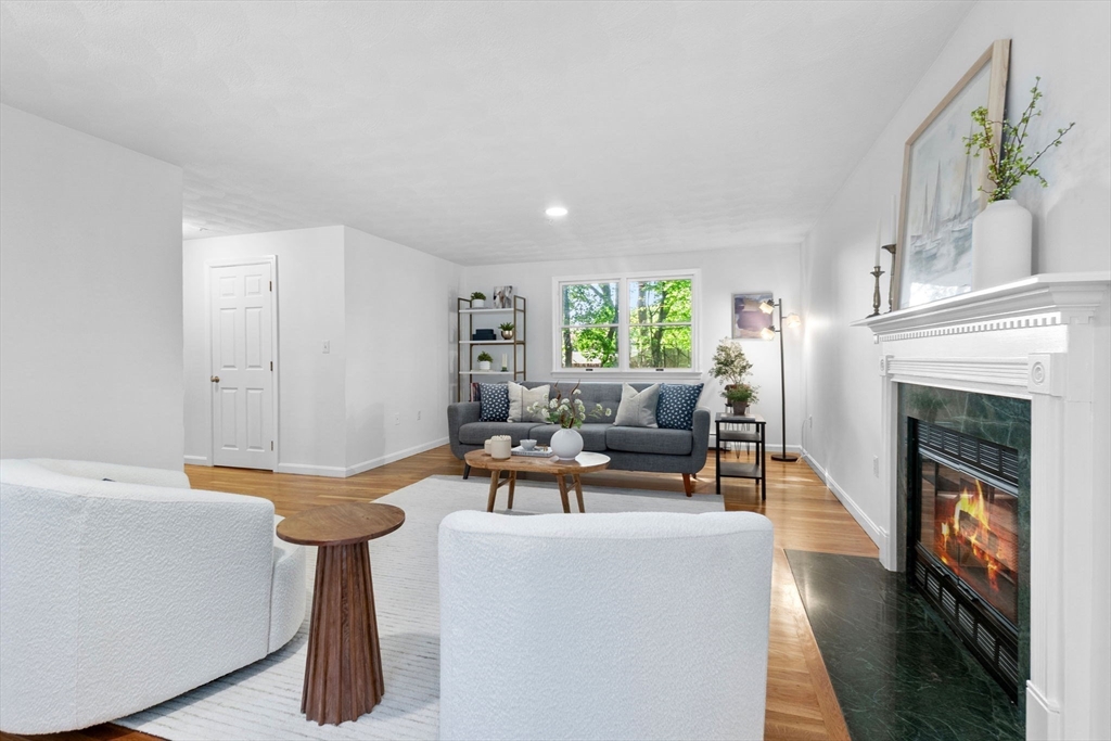 40 Cornell Road Beverly, MA 01915 - Photo 6 of 31 a living room with furniture and a fireplace