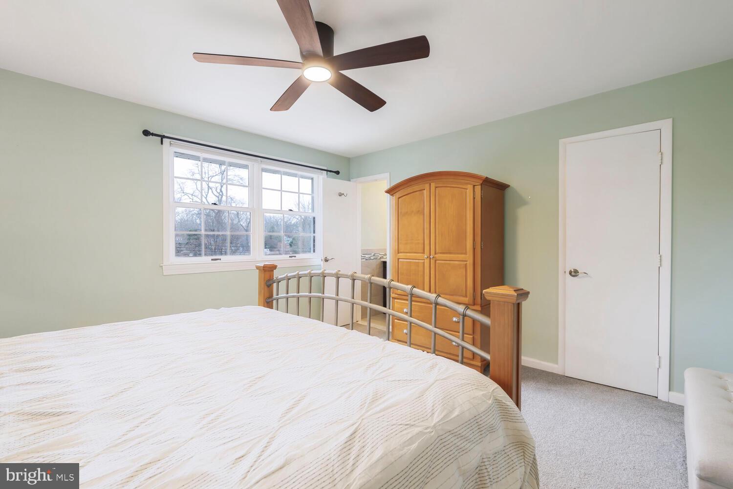 412 Underhill Place Alexandria, VA 22305 - Photo 17 of 45 a bedroom with a bed and a large window