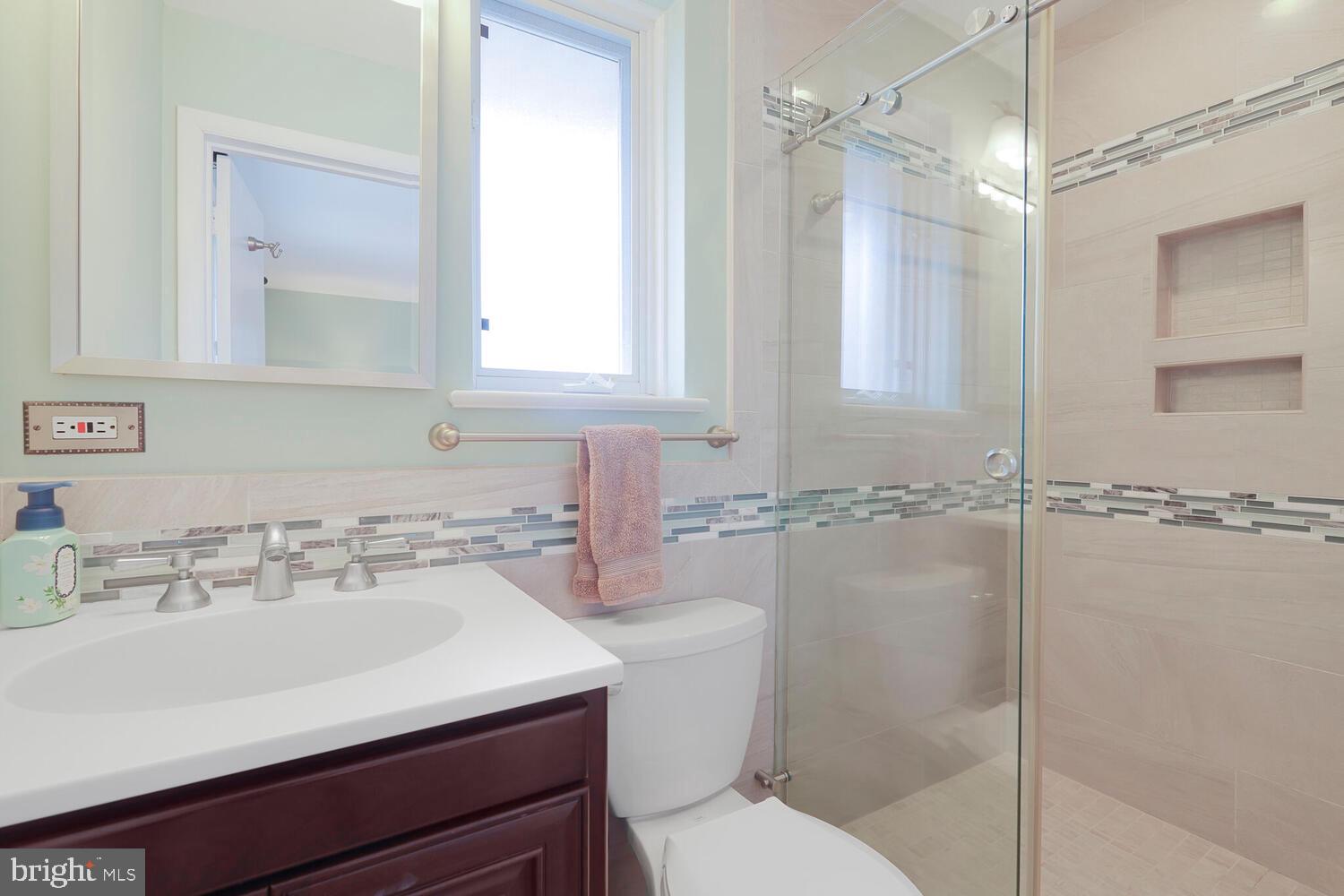 412 Underhill Place Alexandria, VA 22305 - Photo 18 of 45 a bathroom with a sink toilet vanity and shower