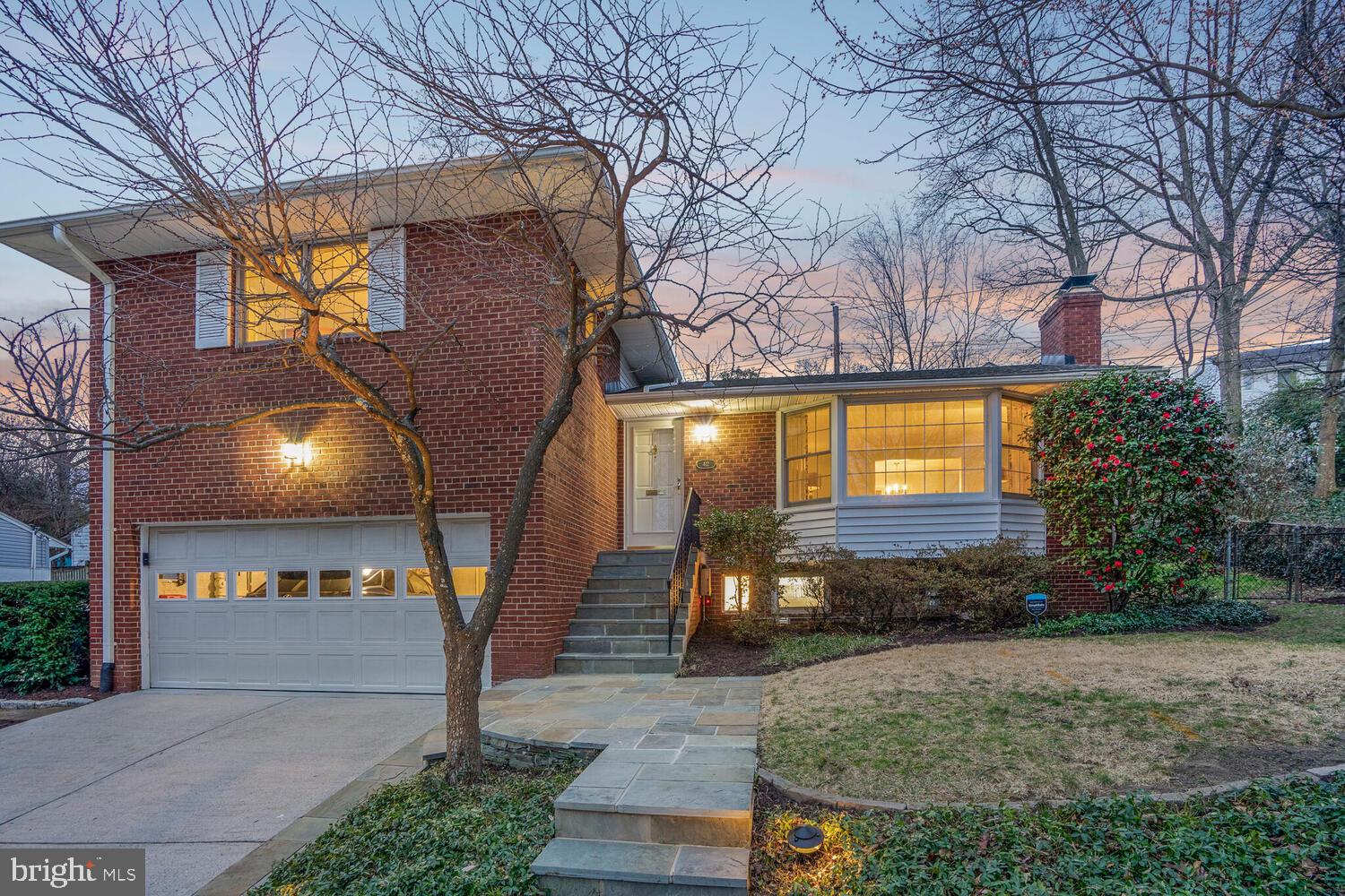 412 Underhill Place Alexandria, VA 22305 - Photo 2 of 45 a front view of a house with a yard and tree s