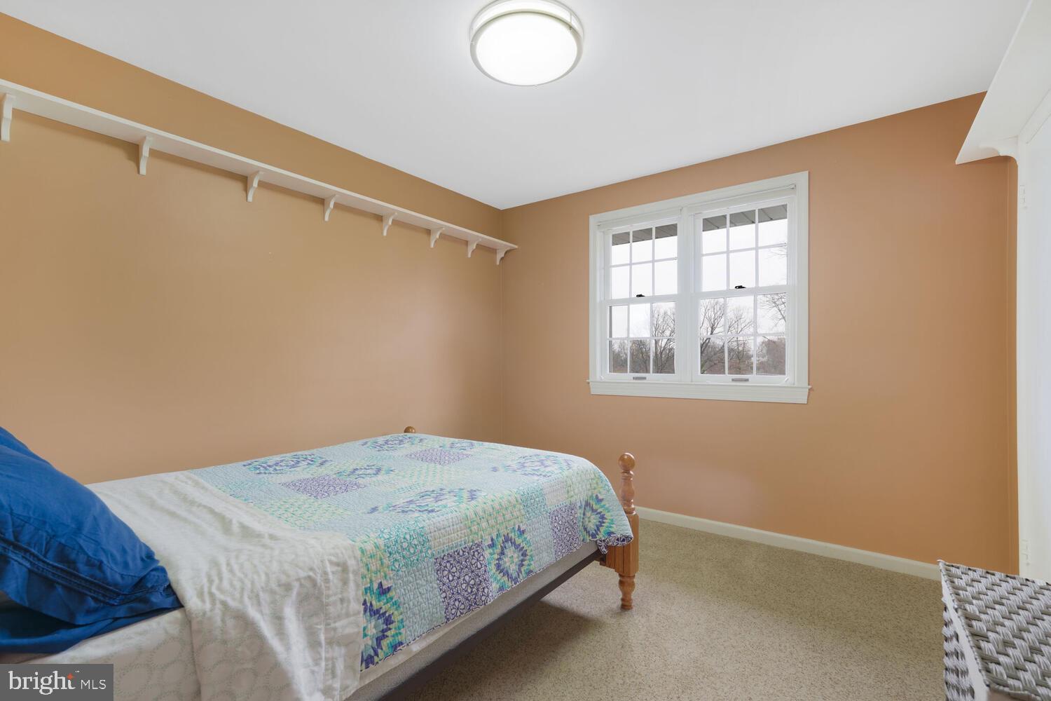 412 Underhill Place Alexandria, VA 22305 - Photo 23 of 45 a bedroom with a bed and a window