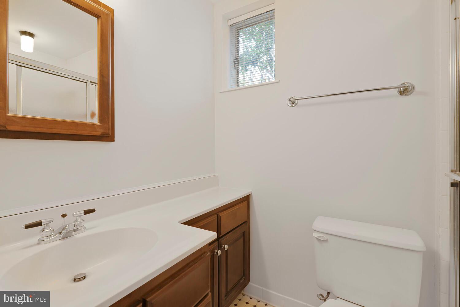 412 Underhill Place Alexandria, VA 22305 - Photo 25 of 45 a bathroom with a sink and a mirror