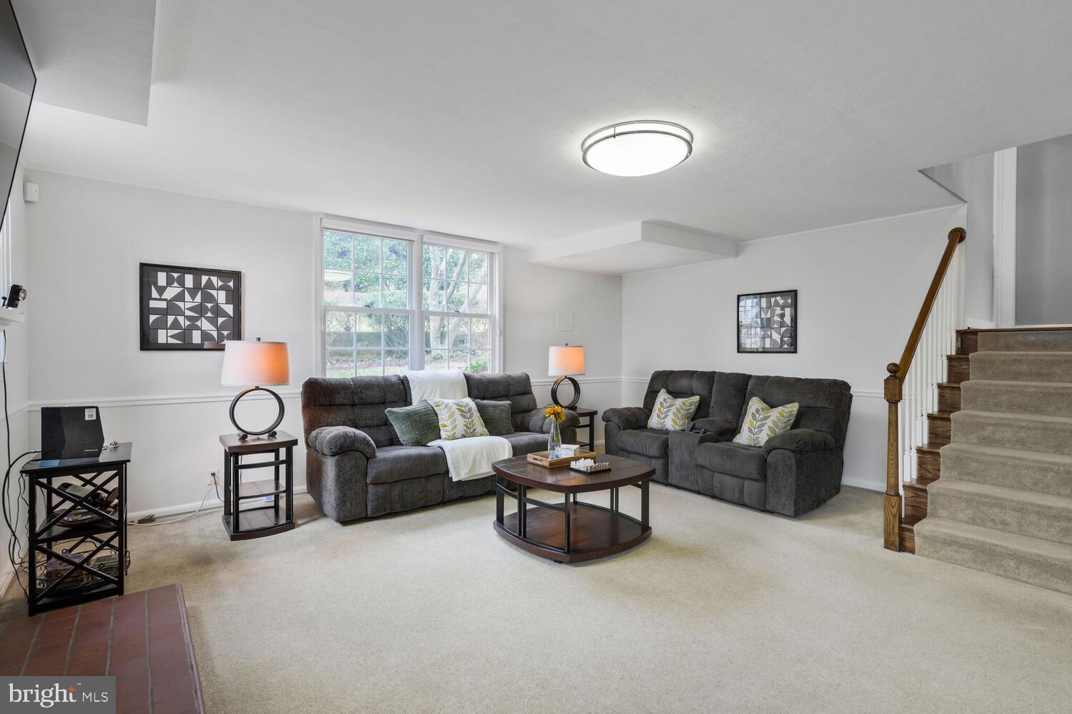 412 Underhill Place Alexandria, VA 22305 - Photo 27 of 45 a living room with furniture and a flat screen tv