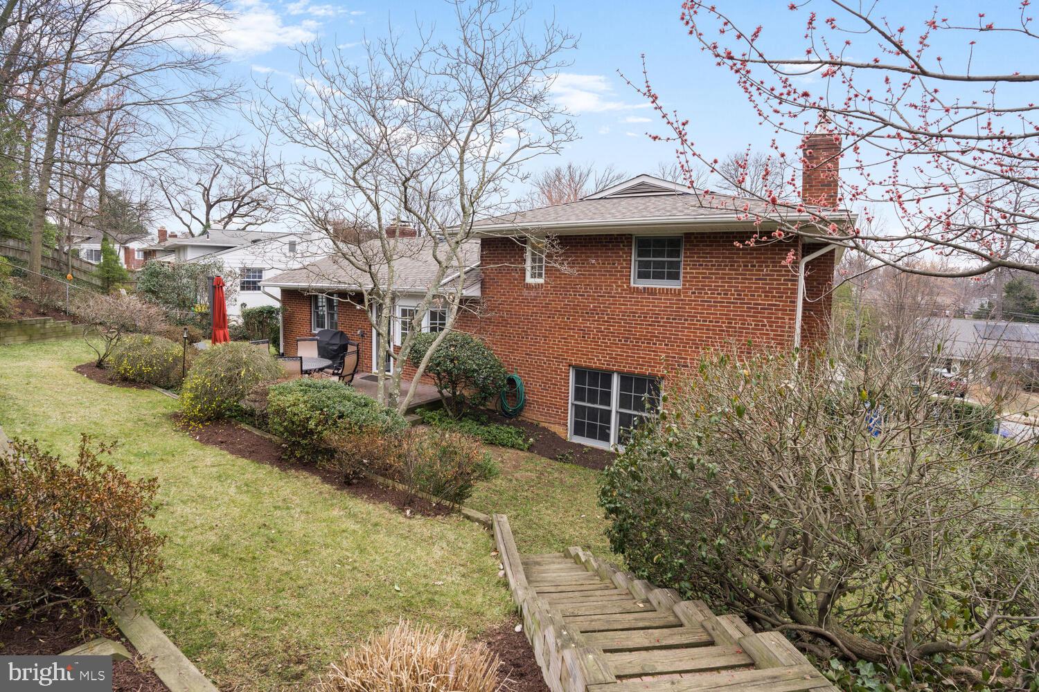 412 Underhill Place Alexandria, VA 22305 - Photo 39 of 45 a front view of a house with a yard and garage