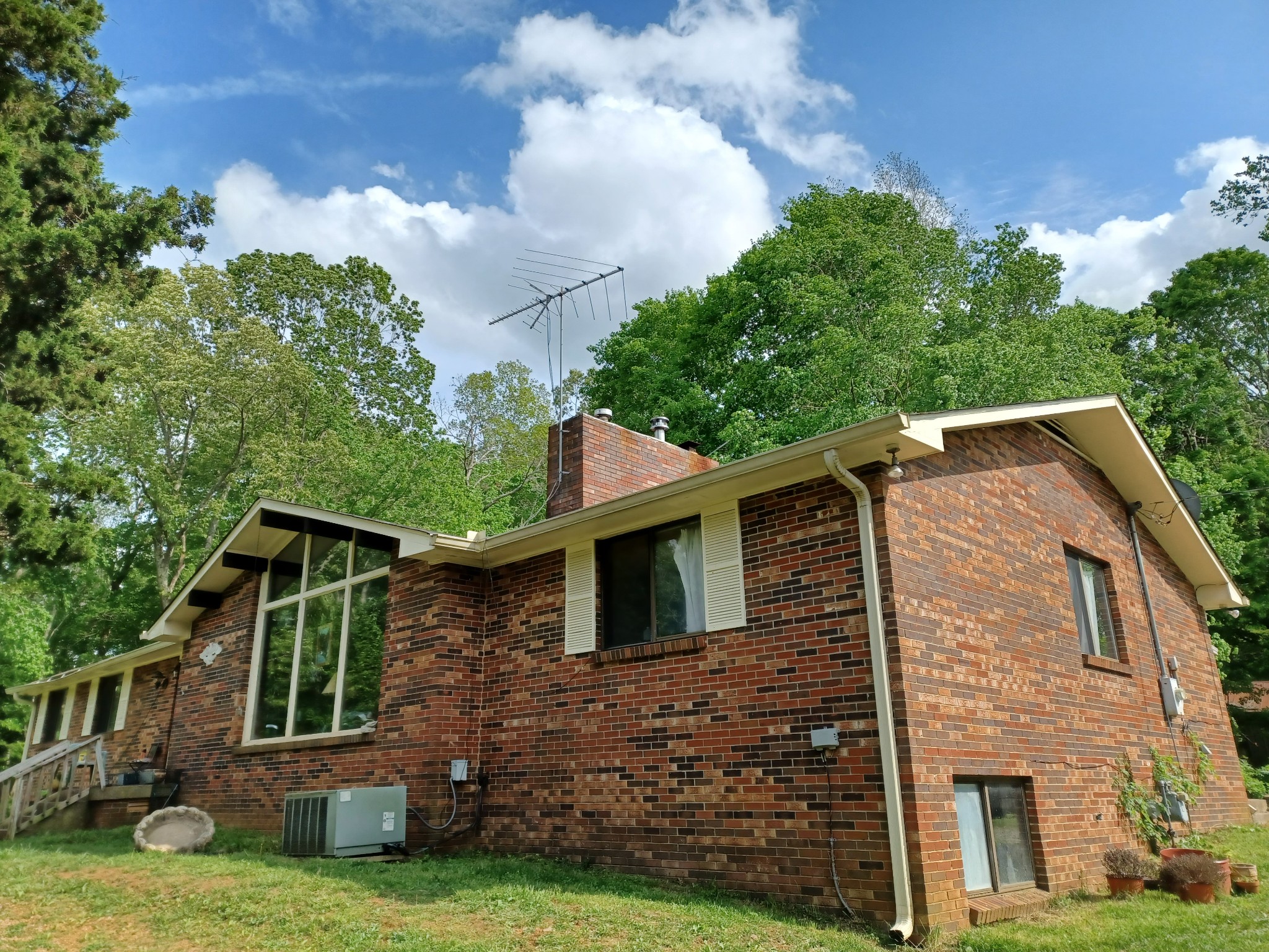 2150 Hogan Road Burns, TN 37029 - Photo 3 of 58 a front view of a house with garden