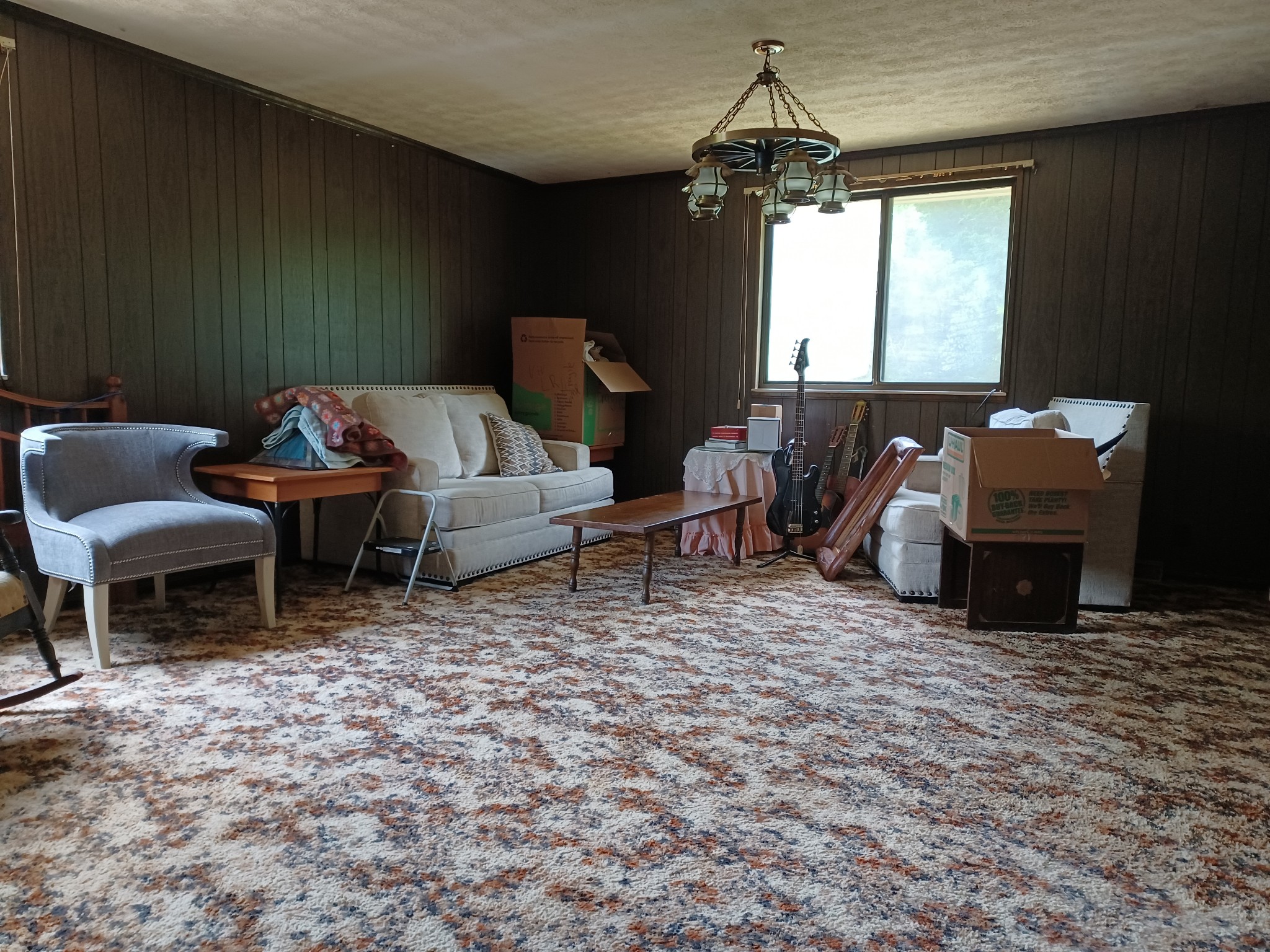 2150 Hogan Road Burns, TN 37029 - Photo 32 of 58 a living room with furniture a window and a chandelier