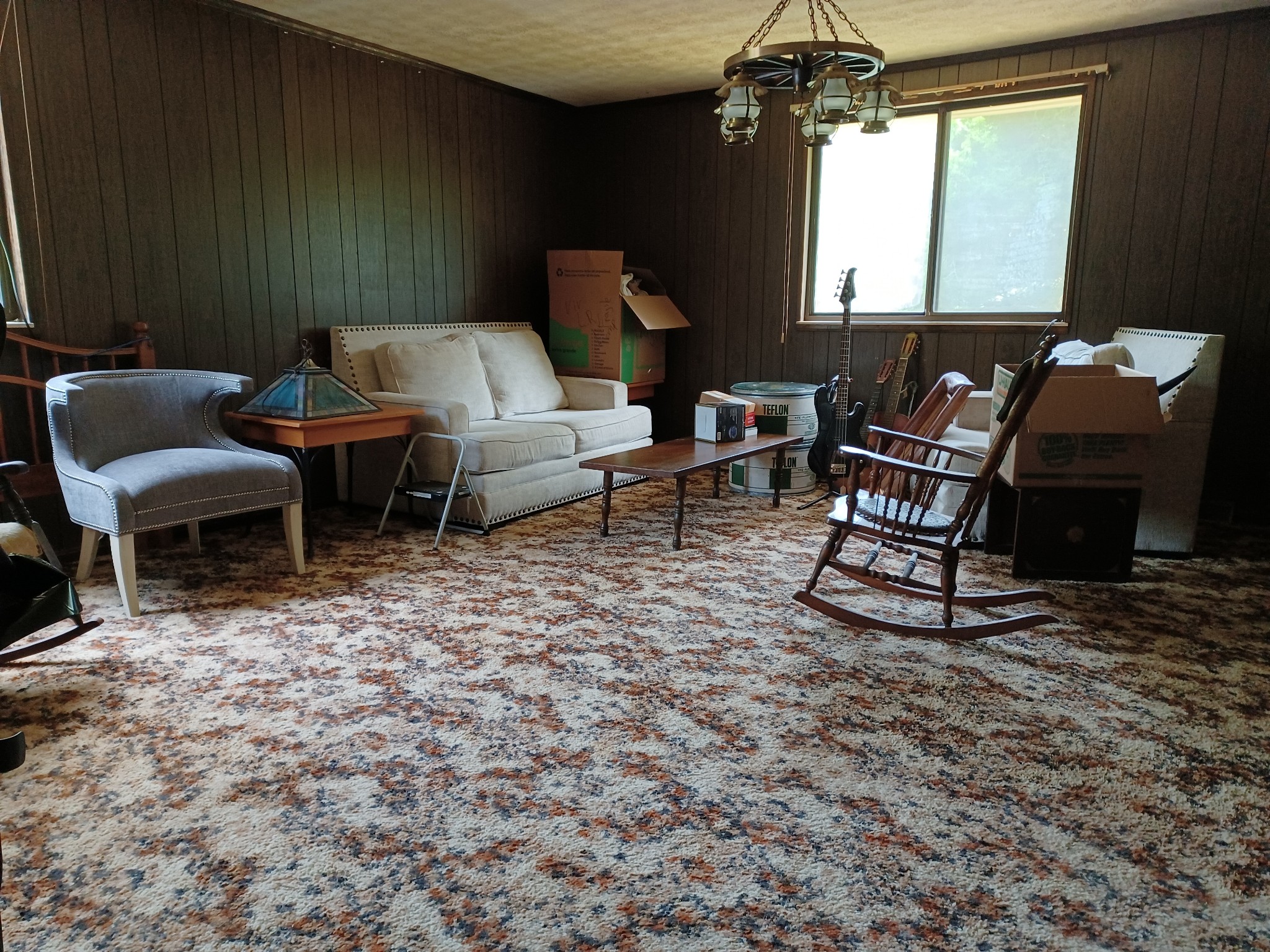 2150 Hogan Road Burns, TN 37029 - Photo 51 of 58 a living room with furniture a chandelier and a window