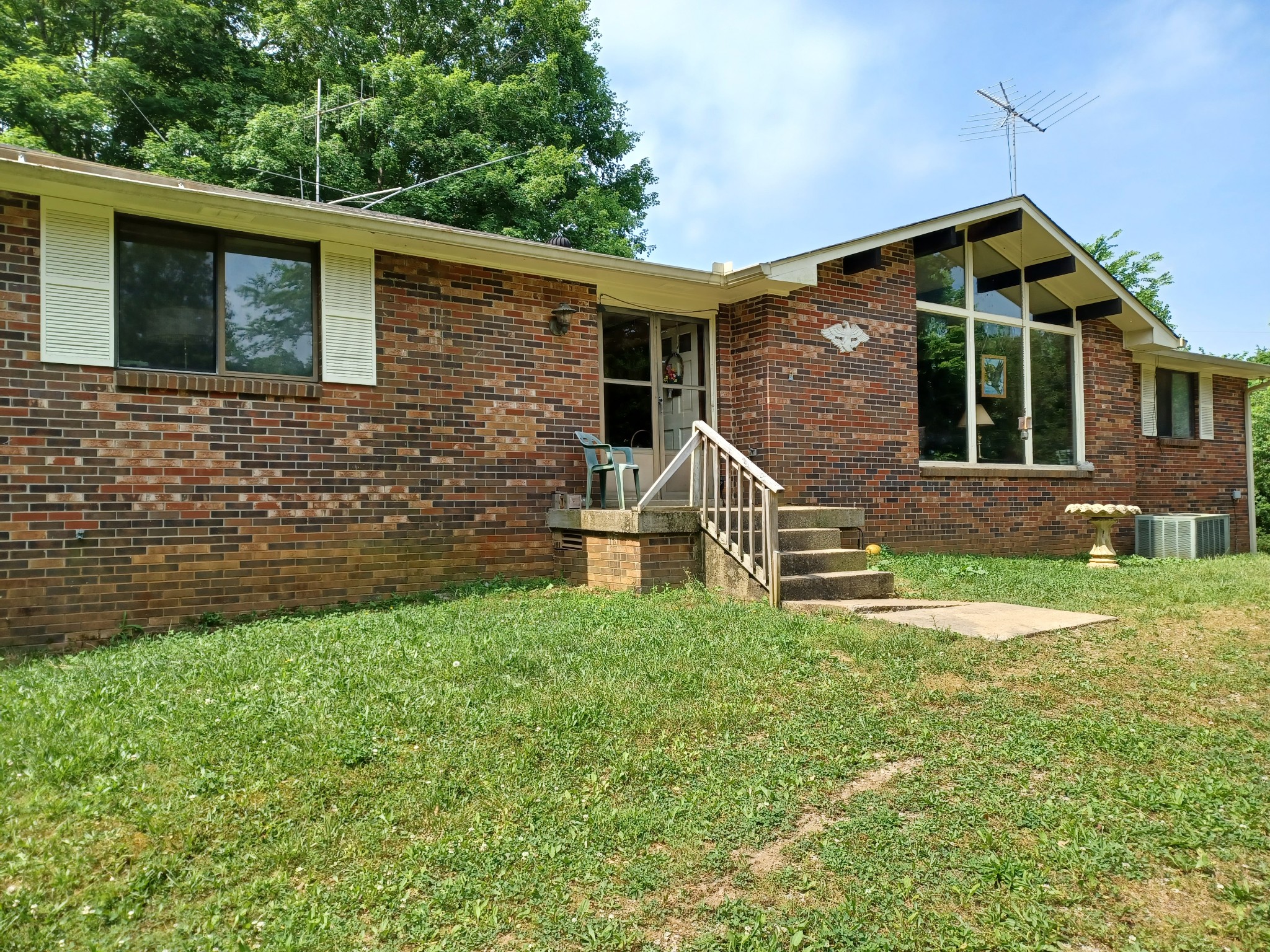 2150 Hogan Road Burns, TN 37029 - Photo 53 of 58 a front view of a house with a yard