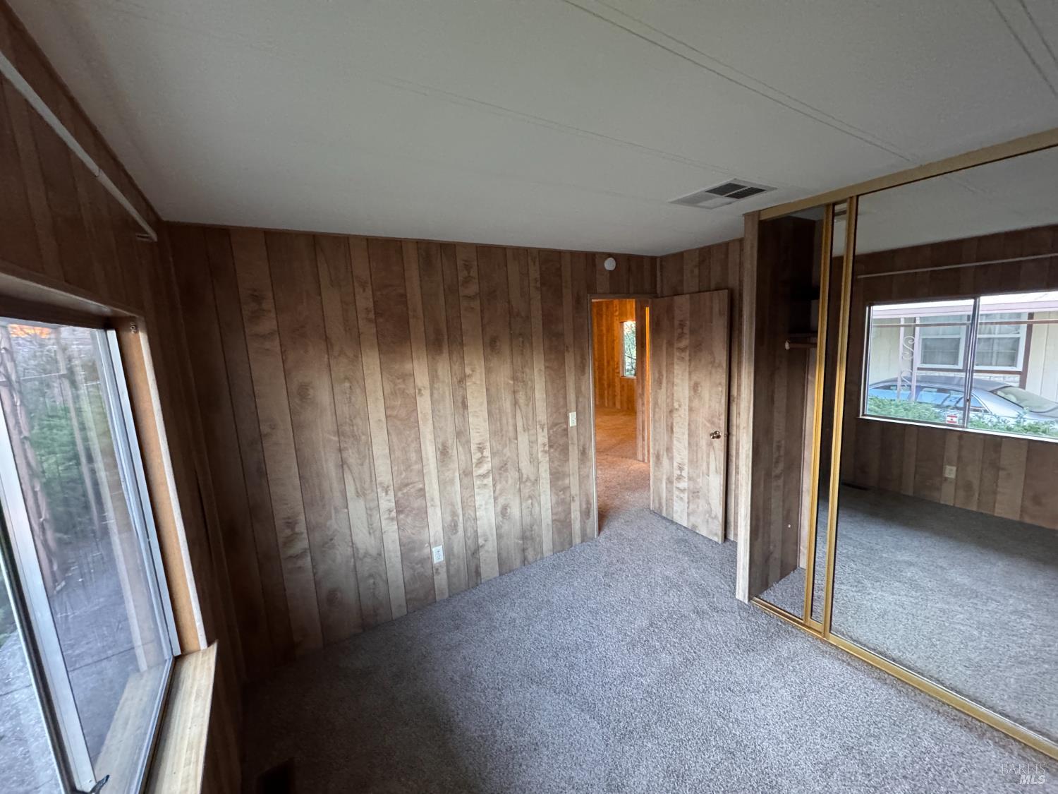 137 Bluestone Court Santa Rosa, CA 95409 - Photo 16 of 35 Hall Bedroom with mirrored wall closet doors