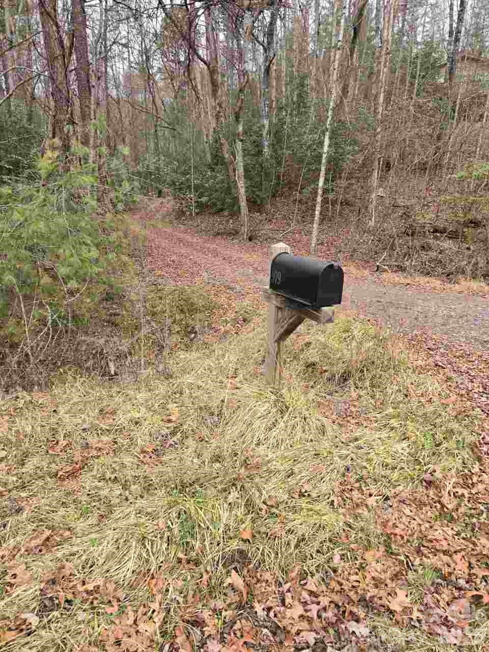 919 Panther Top Road Murphy, NC 28906 - Photo 3 of 8 a backyard of a house with table and chairs