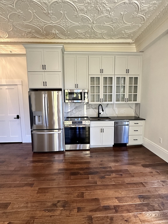 11 Lowell Road, Unit 1A Groton, MA 01450 - Photo 11 of 17 a kitchen with stainless steel appliances a refrigerator sink and cabinets