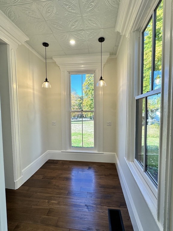 11 Lowell Road, Unit 1A Groton, MA 01450 - Photo 16 of 17 a view of an empty room with wooden floor and a window