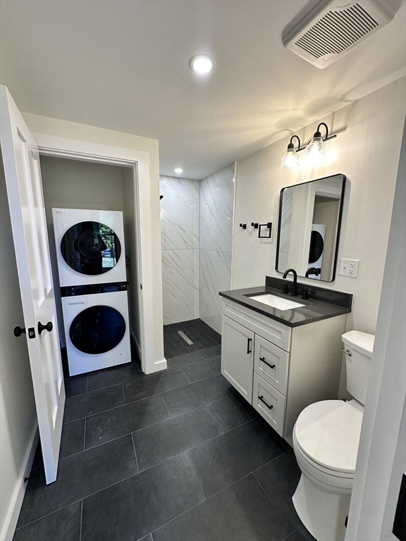 11 Lowell Road, Unit 1A Groton, MA 01450 - Photo 17 of 17 a bathroom with a toilet sink and mirror