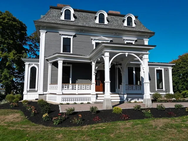 a front view of a house with garden