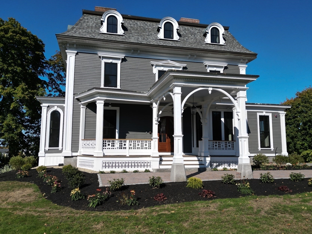 11 Lowell Road, Unit 1A Groton, MA 01450 - Photo 4 of 17 a front view of a house with garden