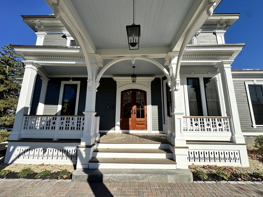 11 Lowell Road, Unit 1A Groton, MA 01450 - Photo 7 of 17 a view of a building with a balcony