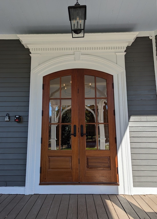 11 Lowell Road, Unit 1A Groton, MA 01450 - Photo 8 of 17 a view of front door and bedroom