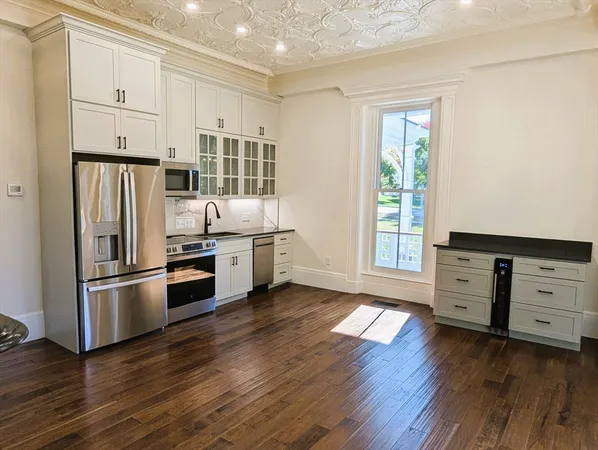 a kitchen with stainless steel appliances a stove and a refrigerator