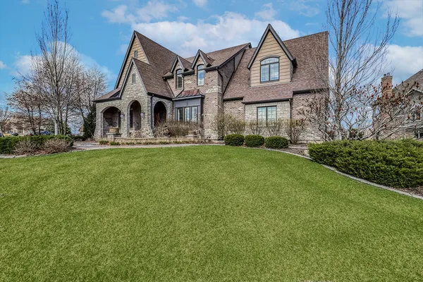 a front view of a house with a yard