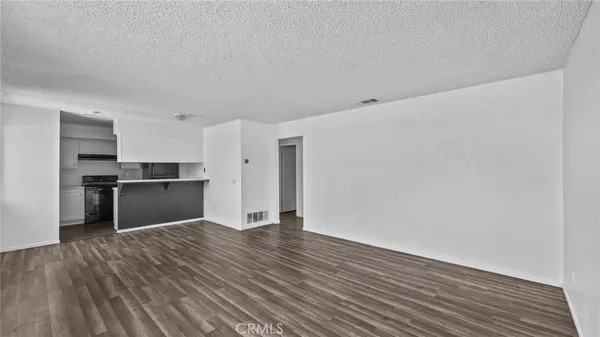 a view of kitchen with wooden floor