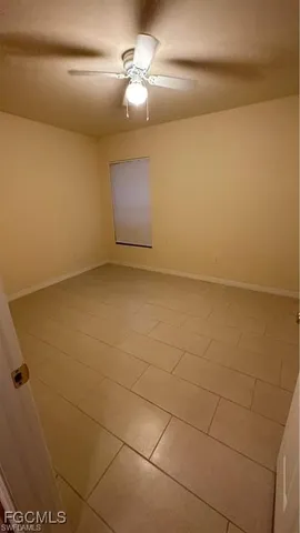 a view of a livingroom with a refrigerator