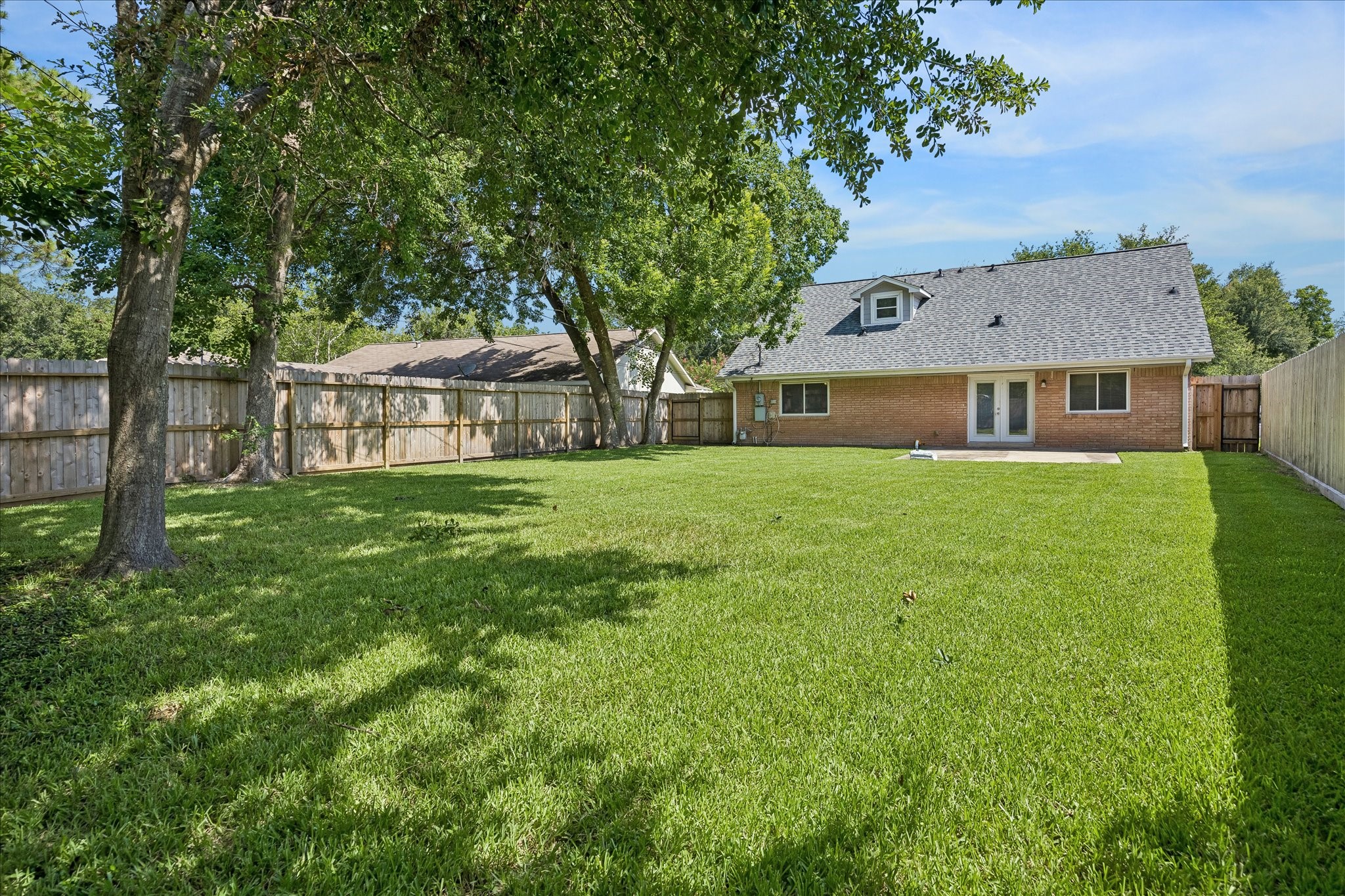 5019 Kinglet Street Houston, TX 77035 - Photo 20 of 24 Huge fully-fenced yard is perfect for entertaining & relaxing! Mature trees offer shade, with plenty of room left for a pool!