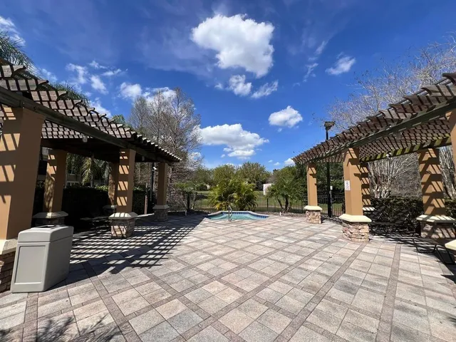 a view of a swimming pool with lounge chair