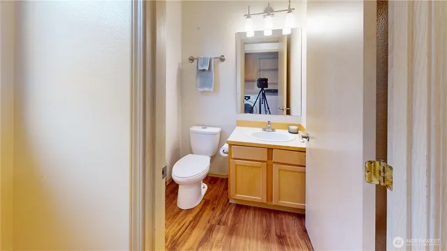 a kitchen with stainless steel appliances granite countertop a sink a stove a microwave and cabinets