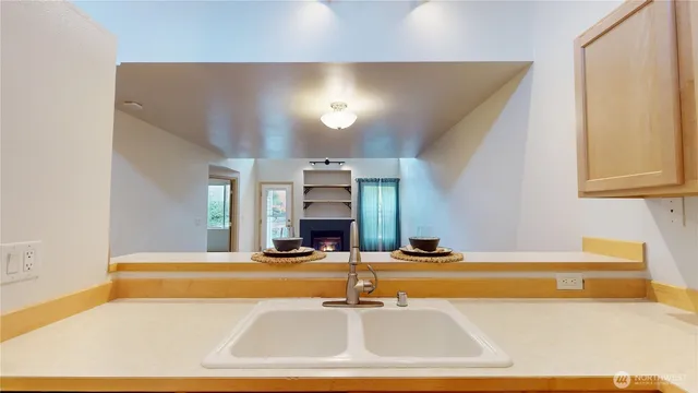 a room with a sink and a mirror