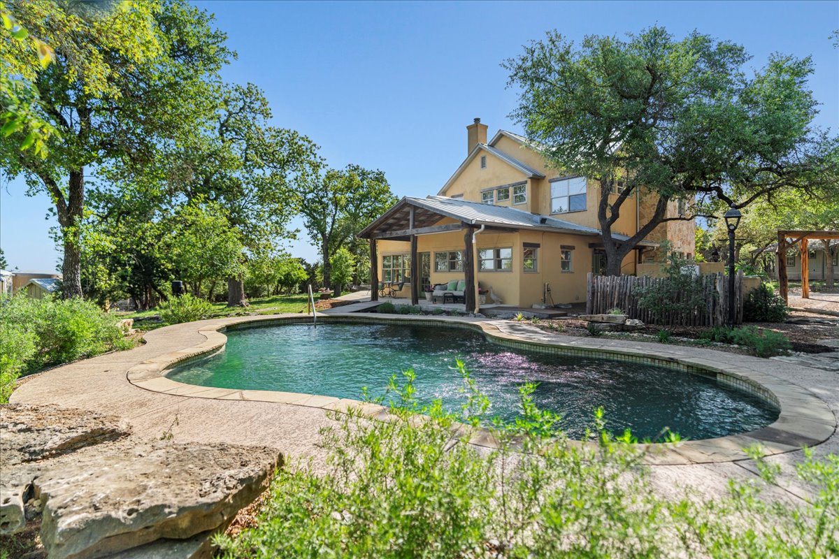 1601 South Rainbow Ranch Road Wimberley, TX 78676 - Photo 1 of 1 Outdoor pool with a patio