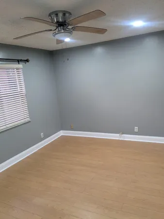 a view of an empty room with a window