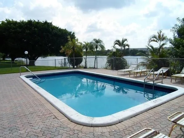 a view of a swimming pool with a patio