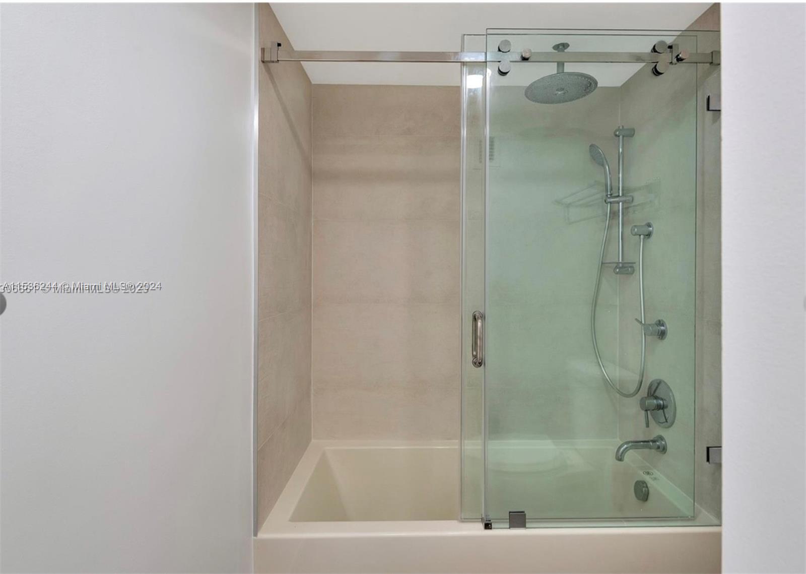 4001 South Ocean Drive, Unit 9F Hollywood, FL 33019 - Photo 18 of 25 a bathroom with a shower