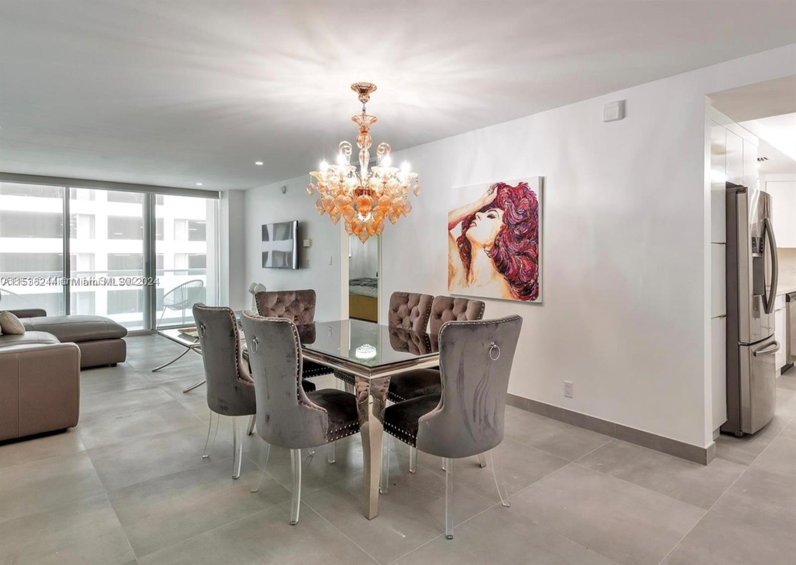 4001 South Ocean Drive, Unit 9F Hollywood, FL 33019 - Photo 2 of 25 a dining room with furniture a livingroom and chandelier