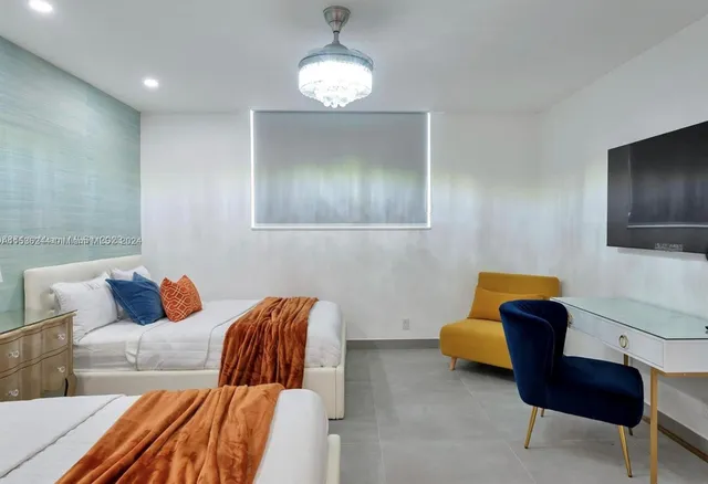 a living room with furniture and a lamp