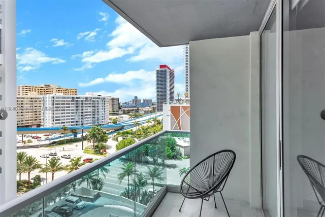 a view of a balcony with chair and table
